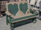 Four-foot poly glider with heart design in back slats in Turf Green and Weathered Wood colors